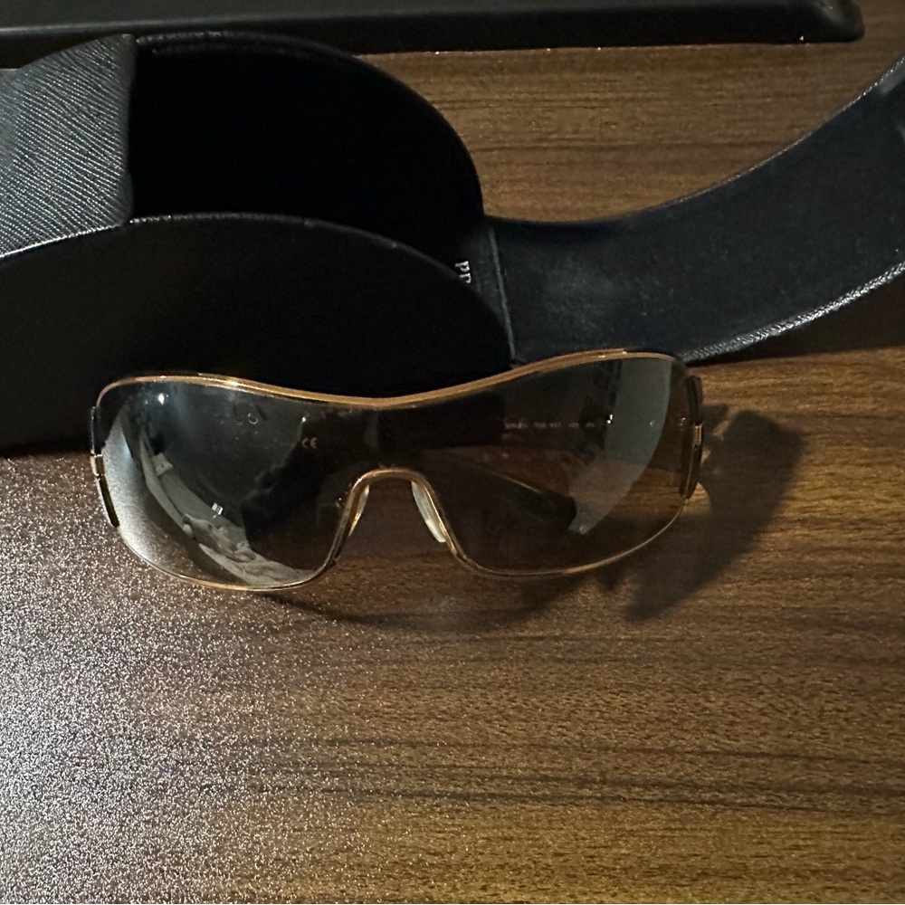 Prada Stylish wrap around Gold rim Sunglasses